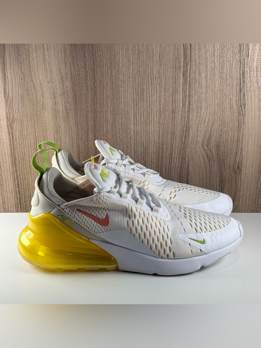 Nike Women’s White Athletic Shoes with Yellow Heel and Pink Swoosh